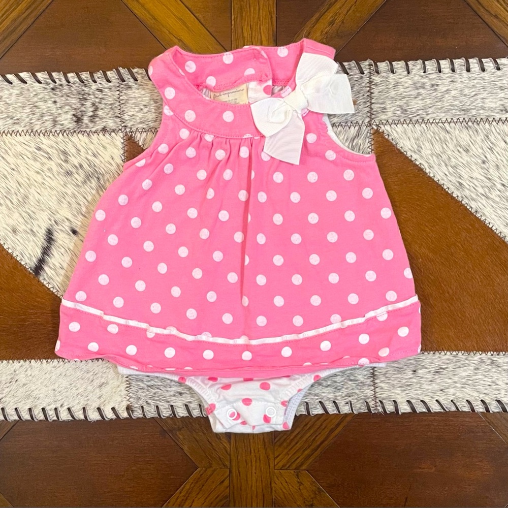 Baby girl’s pink polka dot one piece